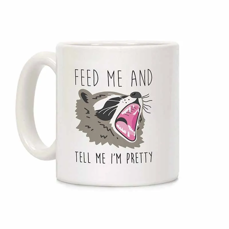 

Feed Me And Tell Me I'm Pretty Raccoon White 11 Ounce Ceramic Coffee Mug