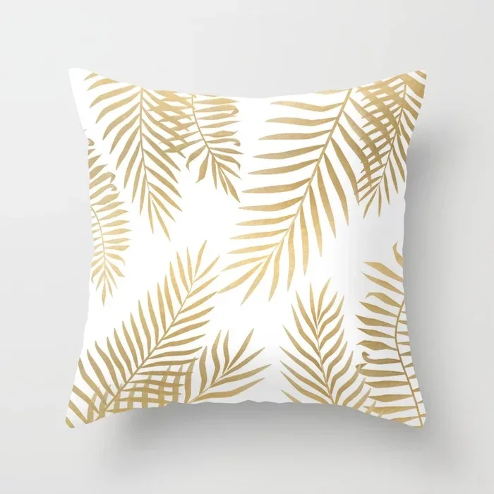 gold-palm-leaves-pillows.webp