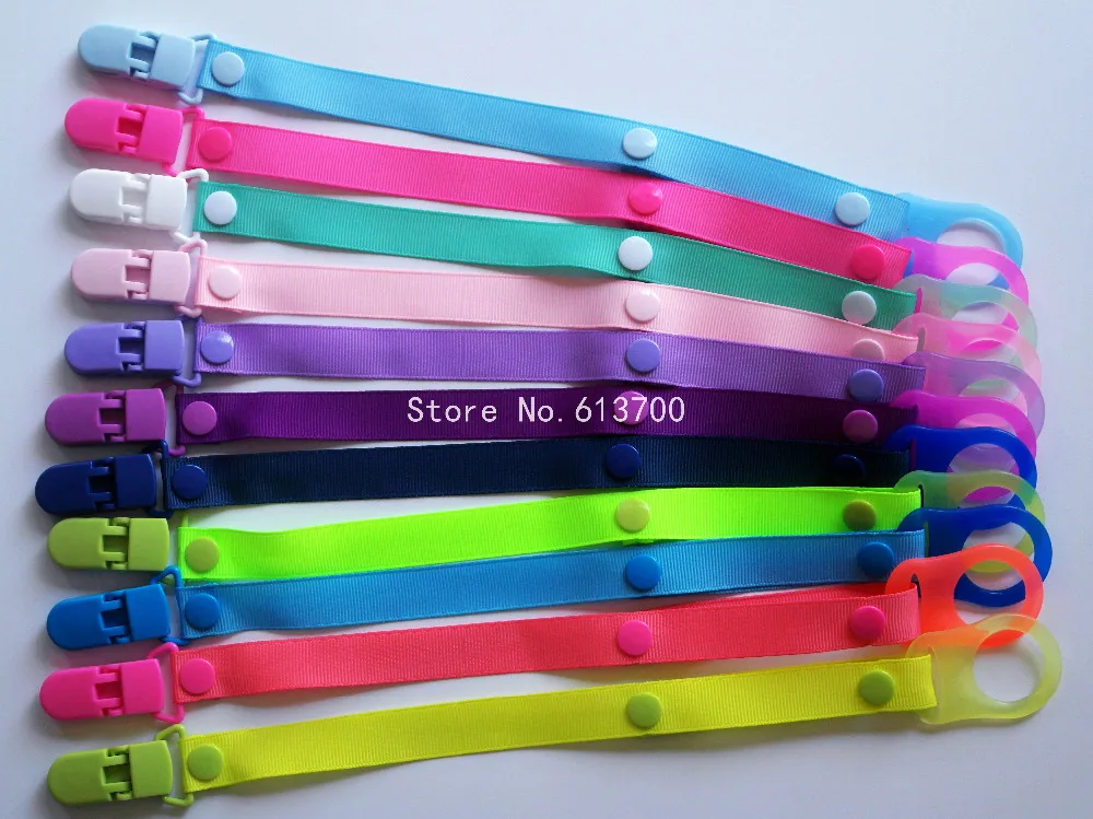 

Wholesale 30 Pcs Plastic Baby Pacifier Chain Clips Holder With MAN Silicone Adapter Rings For Baby Pacifier Drop-resistant belt