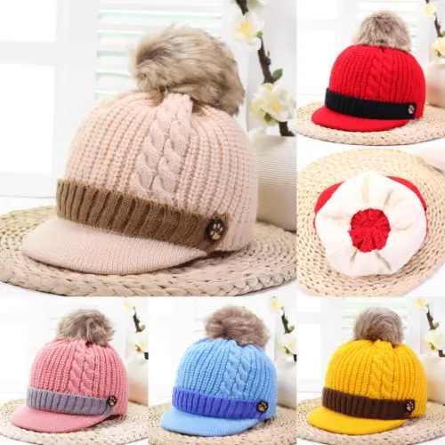 flat hat with a pom pom