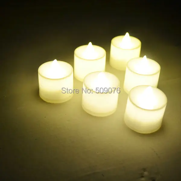 

Free shipping 24pcs/lot Flameless Flicker Battery Operated LED Tea Lights Candles warm White Wedding Xmas Party