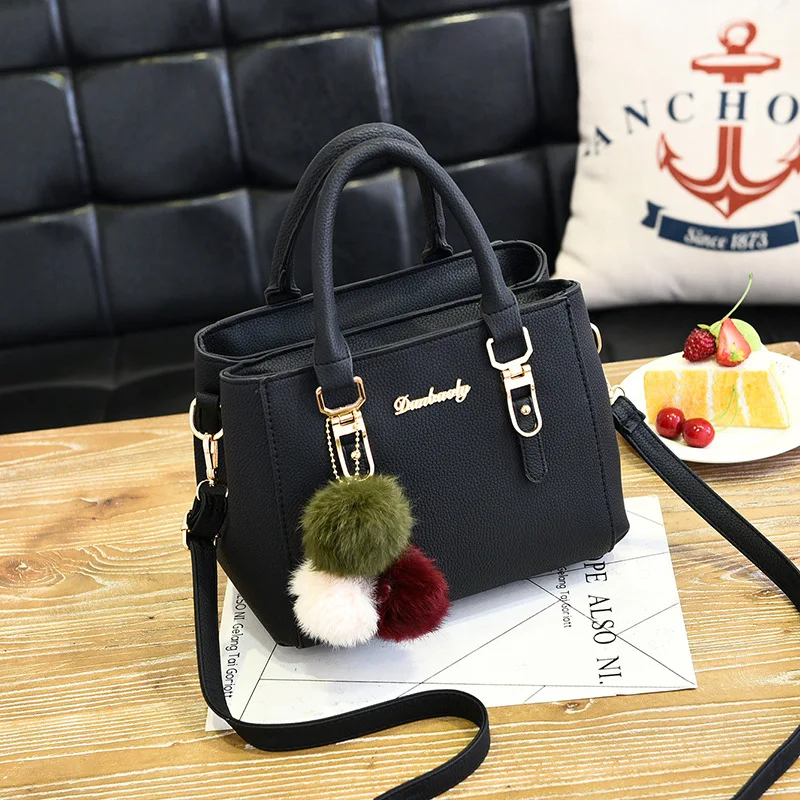 

2018 New Woolly Ball pendant single shoulder bag fashion pure color handheld female simple temperament female a hair generation