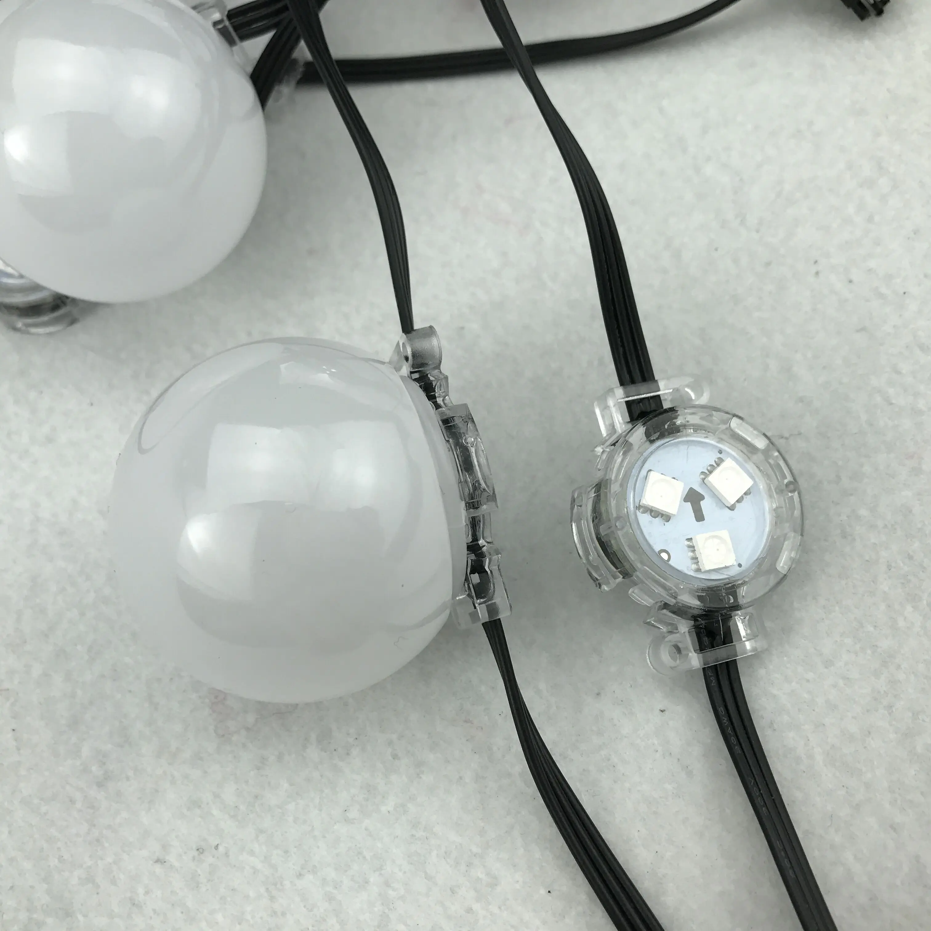

WS2811 DC12V addressable RGB full color pixel module;IP68 rated;50mm frosted cover;30mm base;3leds;0.72W;18AWG all black wire