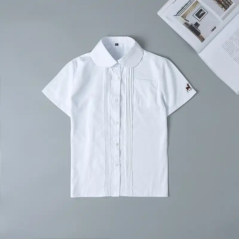 camisa blanca manga corta niño