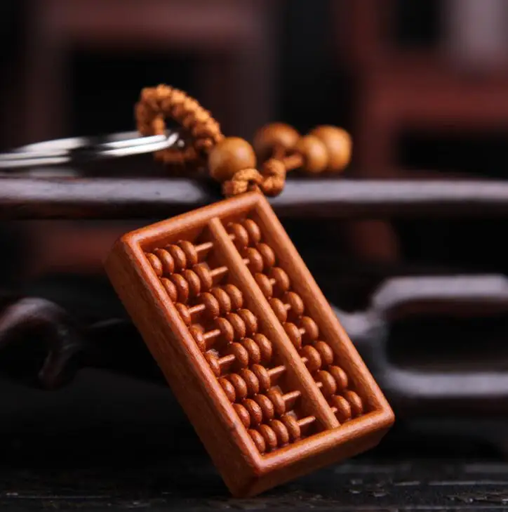 

Chinese Peach Wood Carved Money And Treasures Will Be Plentiful Auspicious Word Abacus Exquisite Car Key Chain Pendant