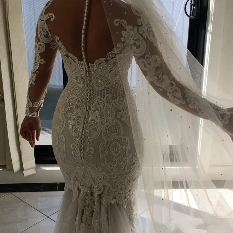 2017-plus-size-mermaid-wedding-dresses-sheer-neckline-lace-appliques-beaded-illusion-long-sleeve-see-through-tulle-long-train-bridal-gowns (1)