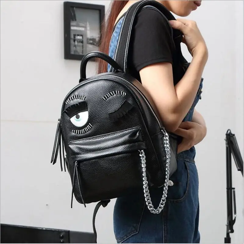 

cartoon demon eyes backpack famous brand monster women leather backpacks metal chain school bag for teenagers travel backpack