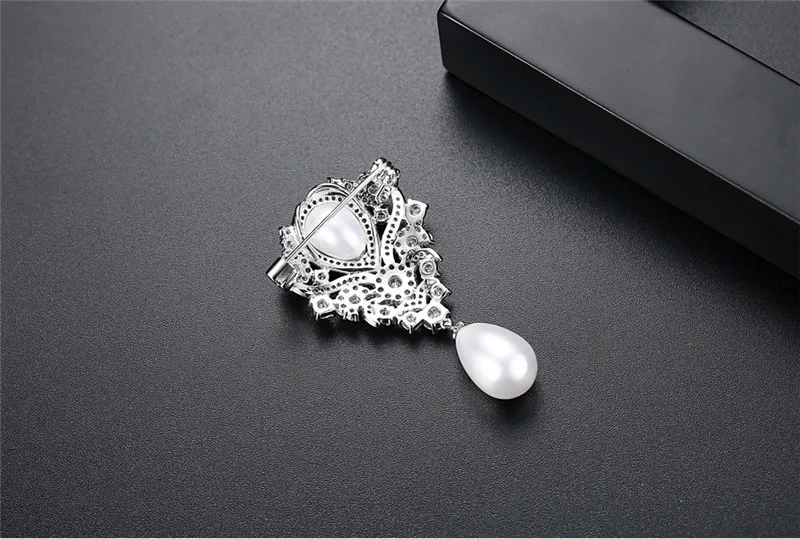 brooched pins (8)
