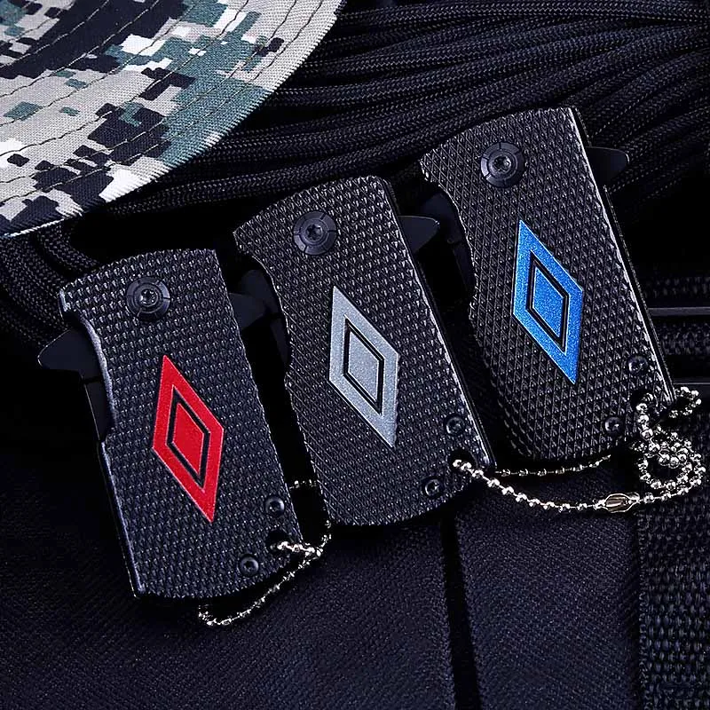 Venta al por mayor Mini plegable defensa táctico cuchillo llavero deportes al aire libre Camping caza trabajando de seguridad herramientas