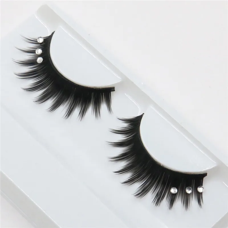 a pair of false eyelashes encrusted exaggerated fashion glitter lashes
