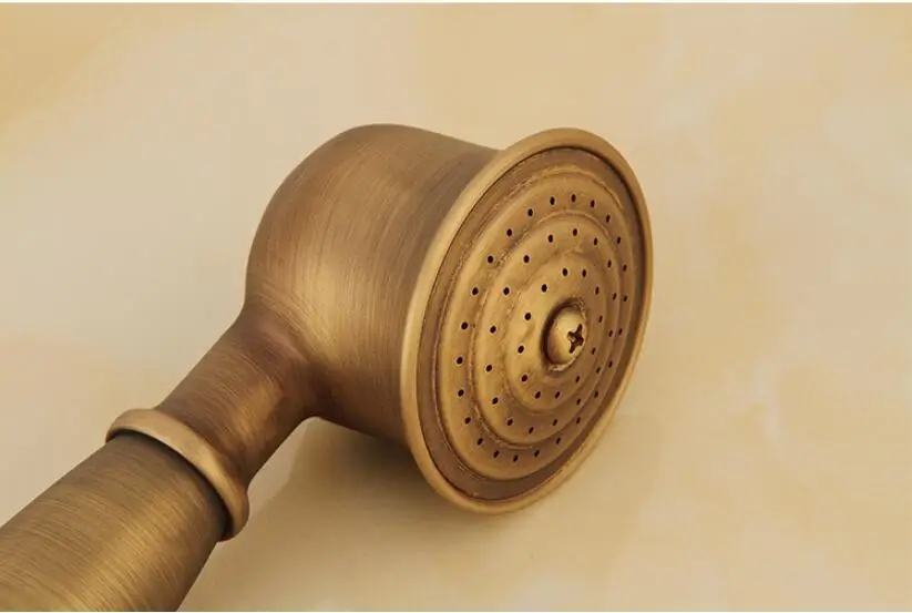 Antigo bronze clássico telefone realizada cabeça de