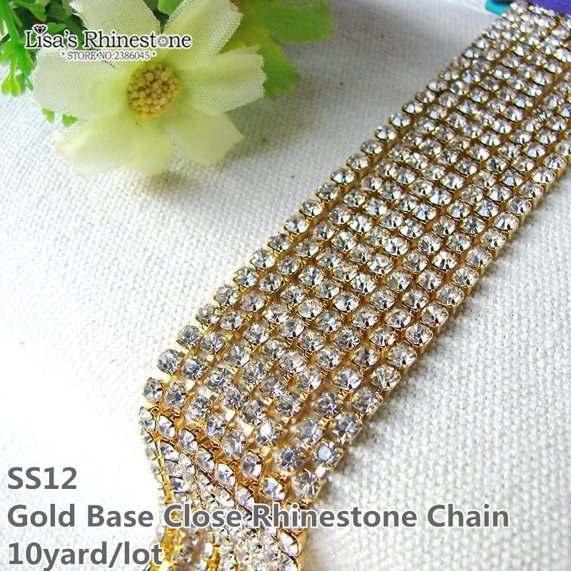 

Hot! 10 yards/lot gold base close clear crystal white rhinestone SS12 Rhinestone Cup Chain For Bags Design 150011-1