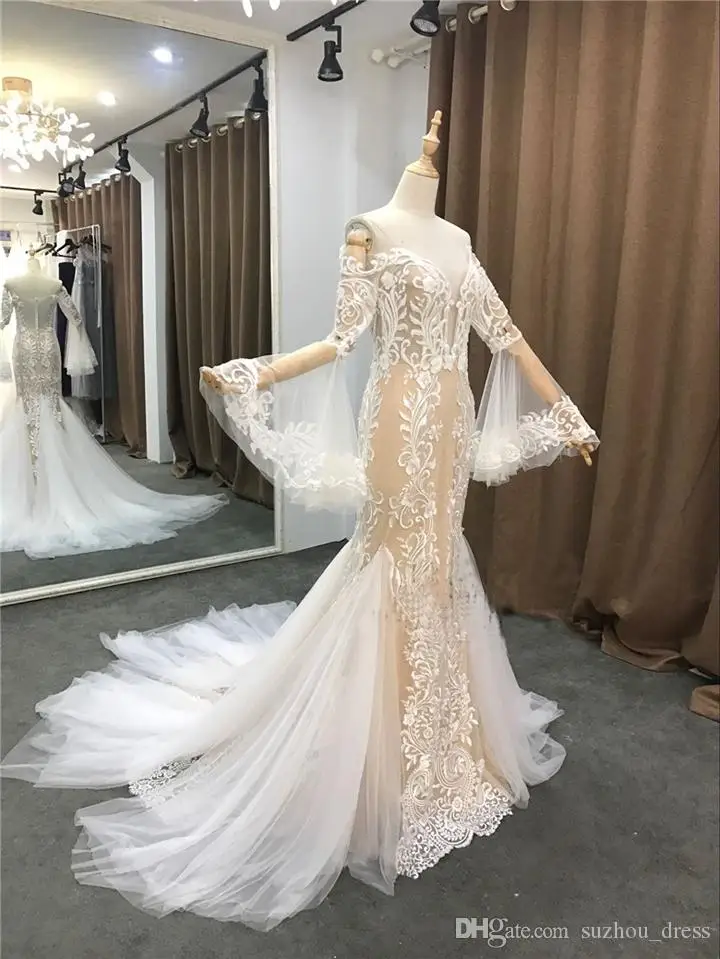 

2019 New Sexy Wedding Dresses Jewel Vintage Neck Illusion Long Sleeves Lace Appliques Backless SweepTrain Sheer Formal