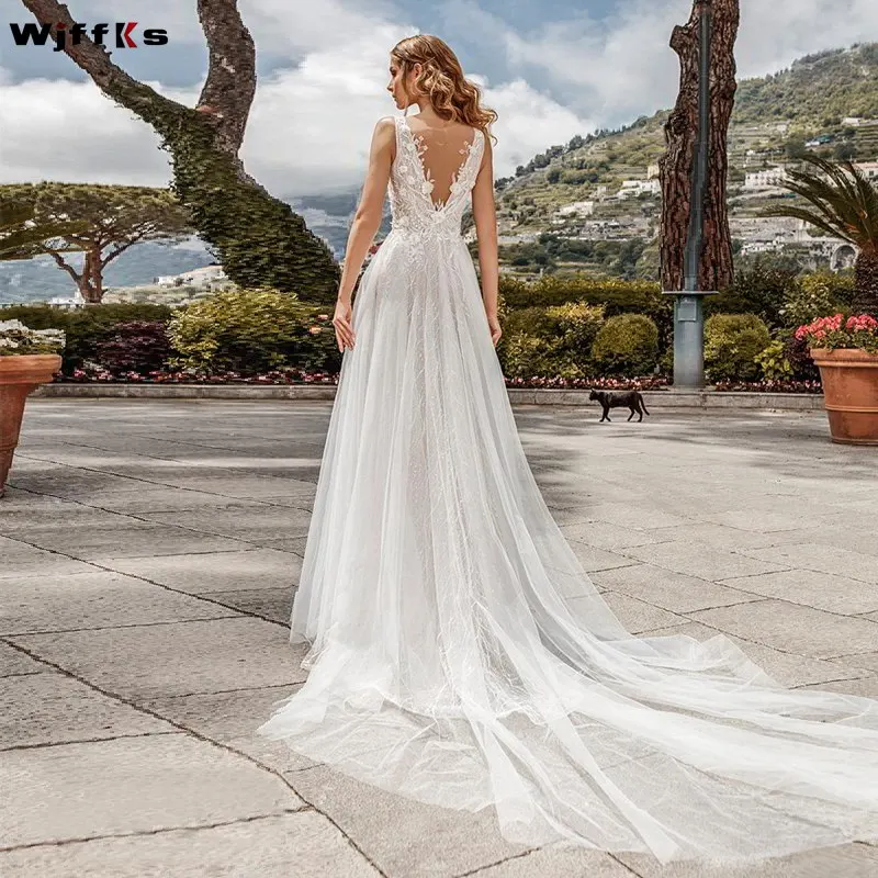 2019-bridal-sleeveless-deep-v-neck-heavily-embellished-bodice-tulle-skirt-romantic-a-line-wedding-dress-v-back-chapel-train