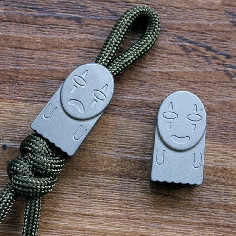 Sprited-Away-No-Face-Man-Titanium-Knife-Beads-Pendant-Hanging-Buckle-EDC-Umbrella-Rope-Pendant-Paracord