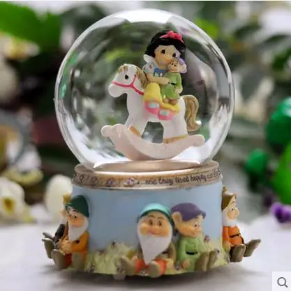 

Snow White and the seven dwarfs rotating crystal ball music box