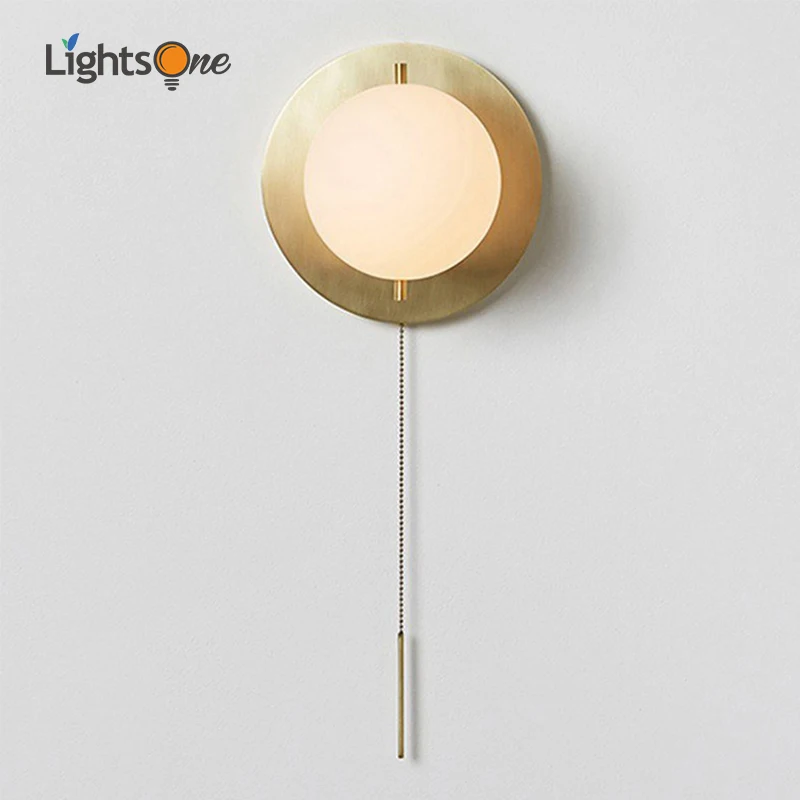 

Postmodern minimalist American designer glass round wall lamp personality living room bedroom corridor brass wall lamp