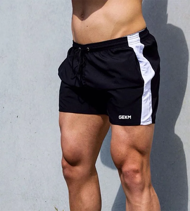 Новые мужские тренажерные залы фитнес свободные шорты бодибилдинг Бег Обучение Лето быстросохнущие классные короткие мужские брюки