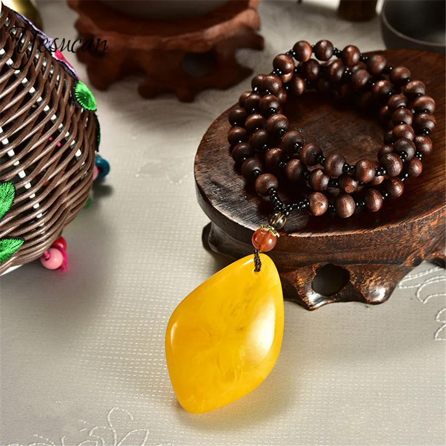 

Yeuscan Bohemia Long Beads Sweater Chain Necklace Ethnic Peaceful Water-Drop Lotus Leaf Fish Pendant Yellow Stone Pendant Choker