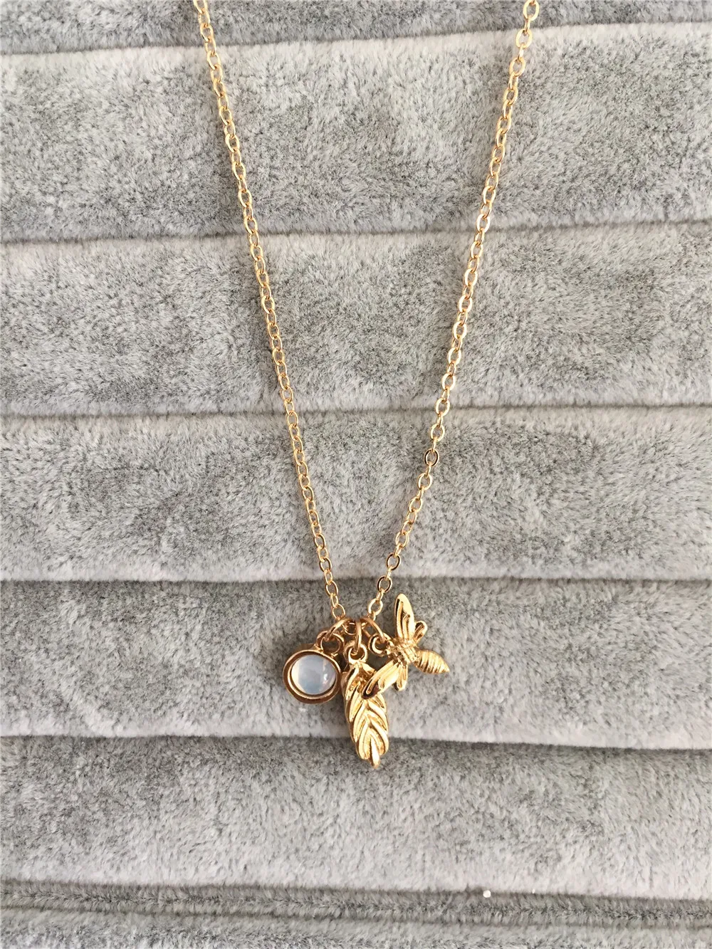 

Gold bee wheat stone pendant necklace