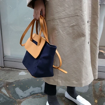 

Bag female new niche design color matching portable bucket diagonal canvas