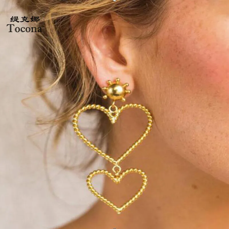 

Tocona New Trendy Charming Romantic Cute Hollow Heart Pendant Earrings Gold Color Hot Selling WOmen Ladies Jewelry Gift C11208