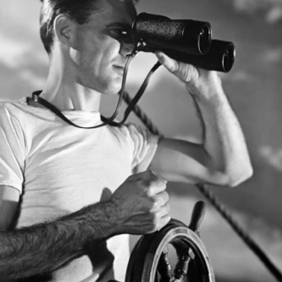 Sailor steering a boat and looking through a pair of binoculars Poster Print (18 x 24)