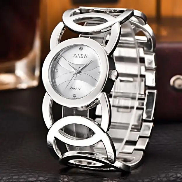 XINEW Лидирующий бренд, женские модные часы, женские стильные кварцевые наручные часы из нержавеющей стали, женские часы с браслетом, Reloj# JO