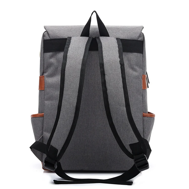 the backside of a grey backpack