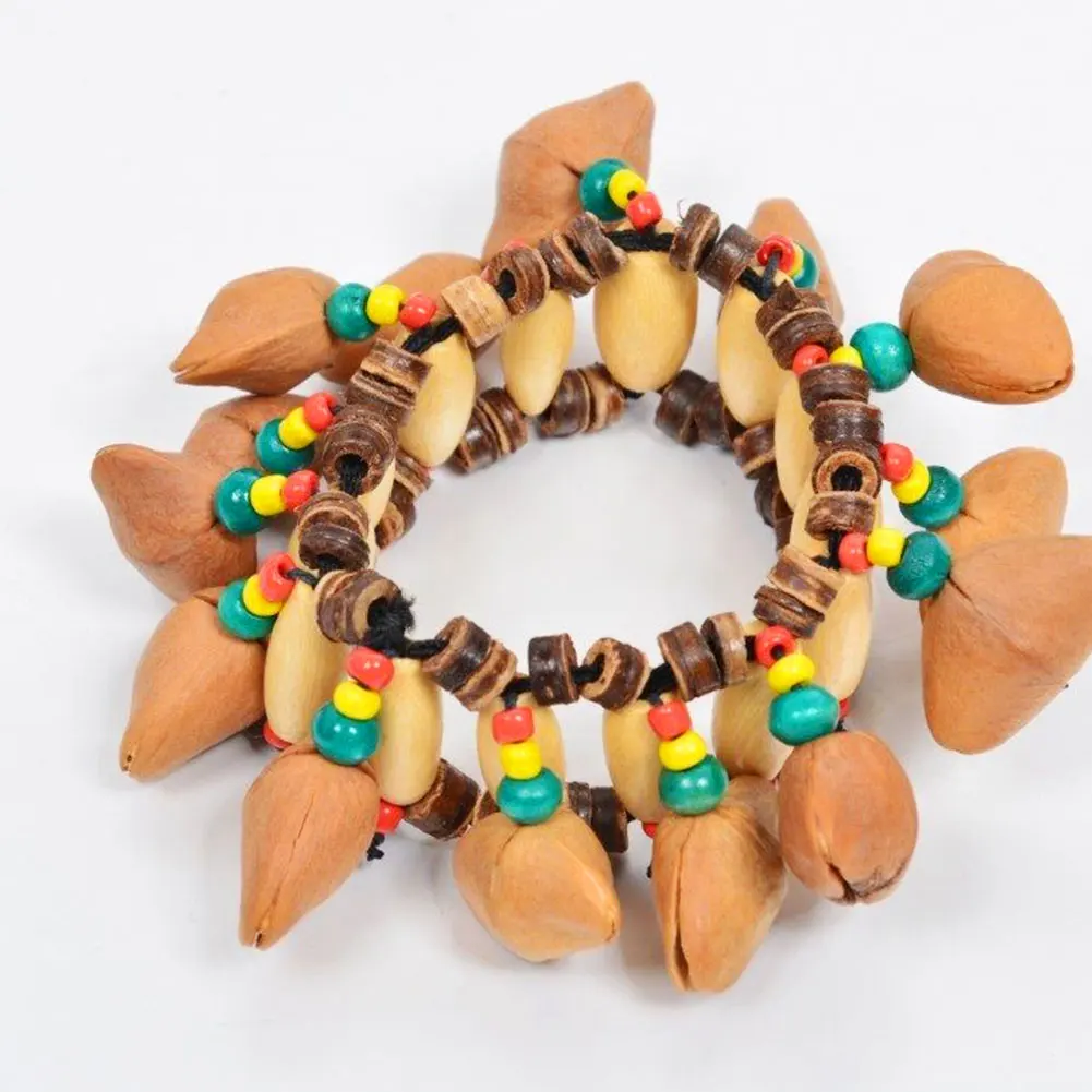 

Nut Shell Orchestral Hand Chain Percussion Bracelet African Drum Handbell 12 * 7 * 5.5cm Durable
