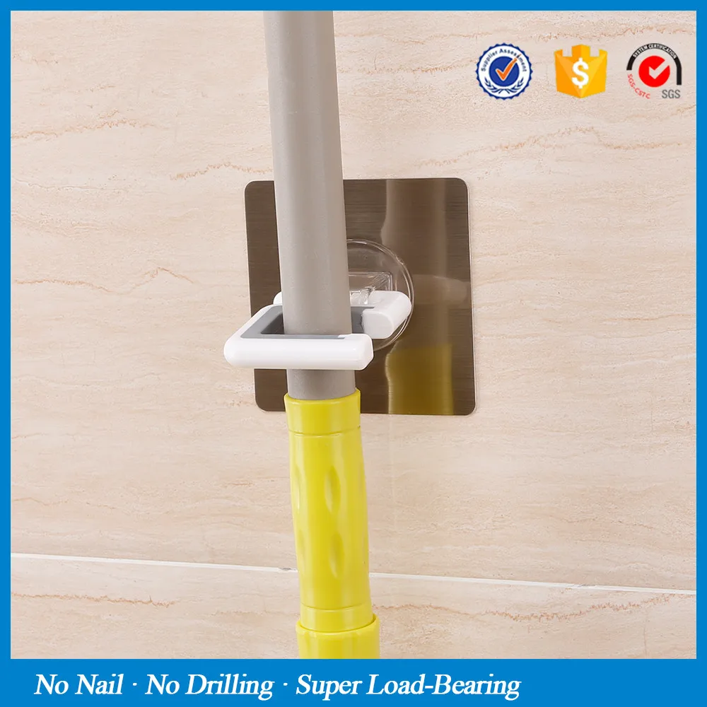 wall-mounted-broom-holder-kitchen-bathroom-wall-mop-holder-magic-sticker-max-loading-5kg-broom-mop (2)