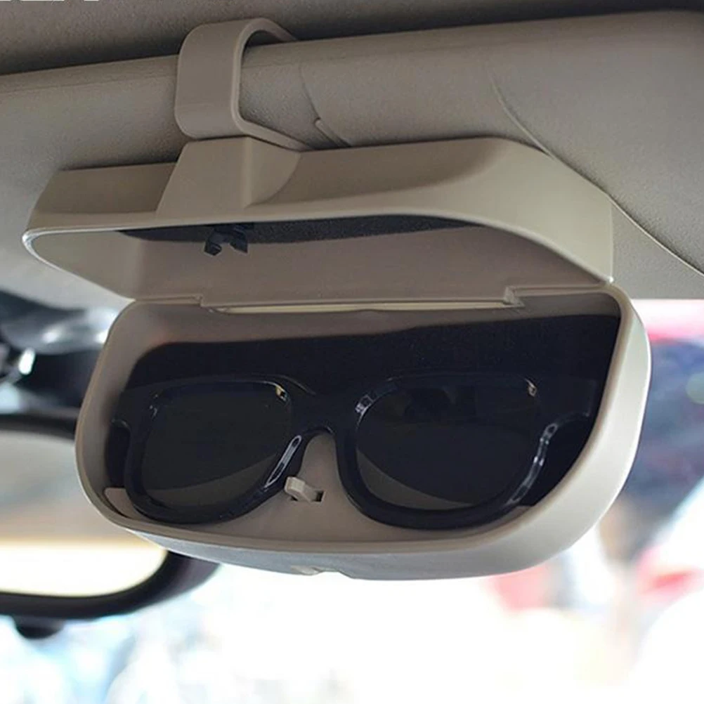 Держатели солнцезащитных очков. Держатель для очков. Держатель очков на козырек. Что такое кронштейн в оправе. Автомобильный держатель для очков.