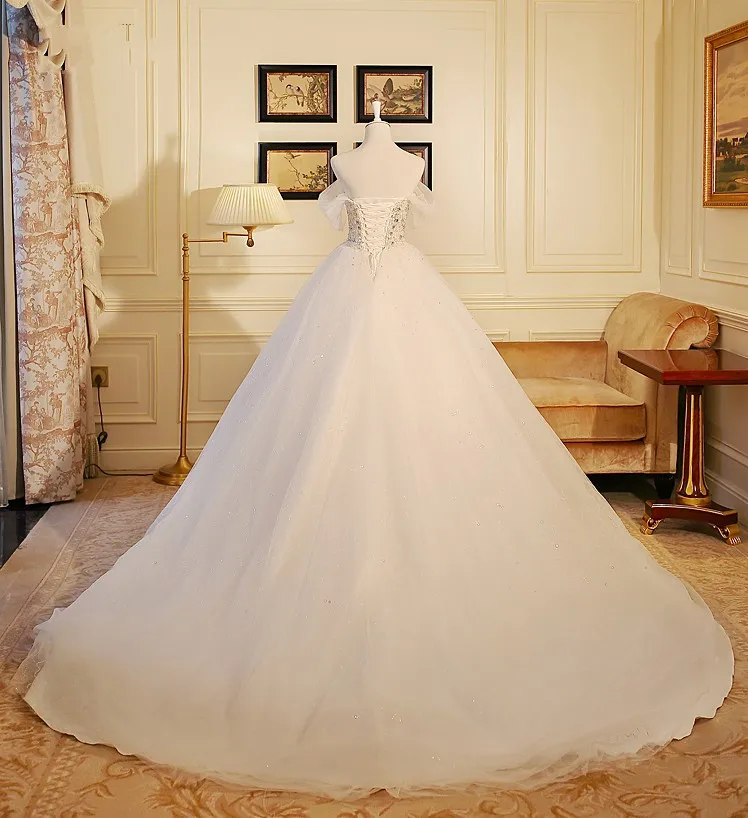 Vestido De Noiva Strapless Heavy Beads Bodice Luxury Wedding Dress Vestido De Noiva Strapless Heavy Beads Bodice Luxury Wedding Dress Sequined Tulle Robe Mariage 2018 Gowns In Dresses From Weddings Events