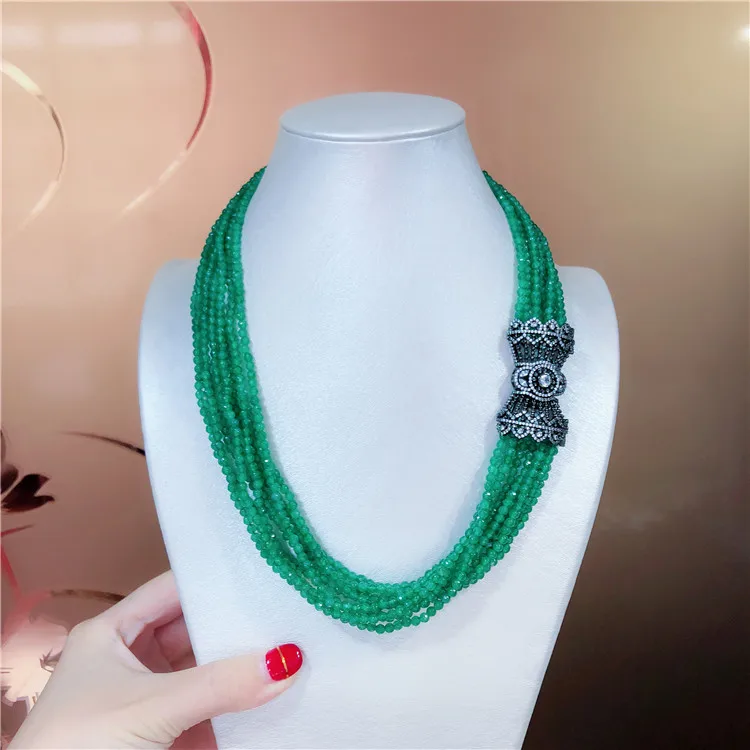 

Hand knotted natural dongling faced green stone beads multilayer micro inlay zircon flower basket clasp necklace sweater chain