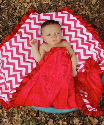 red baby swaddle