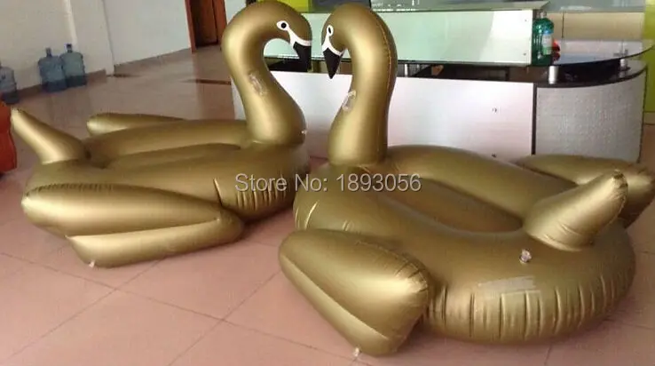 2 gold swans