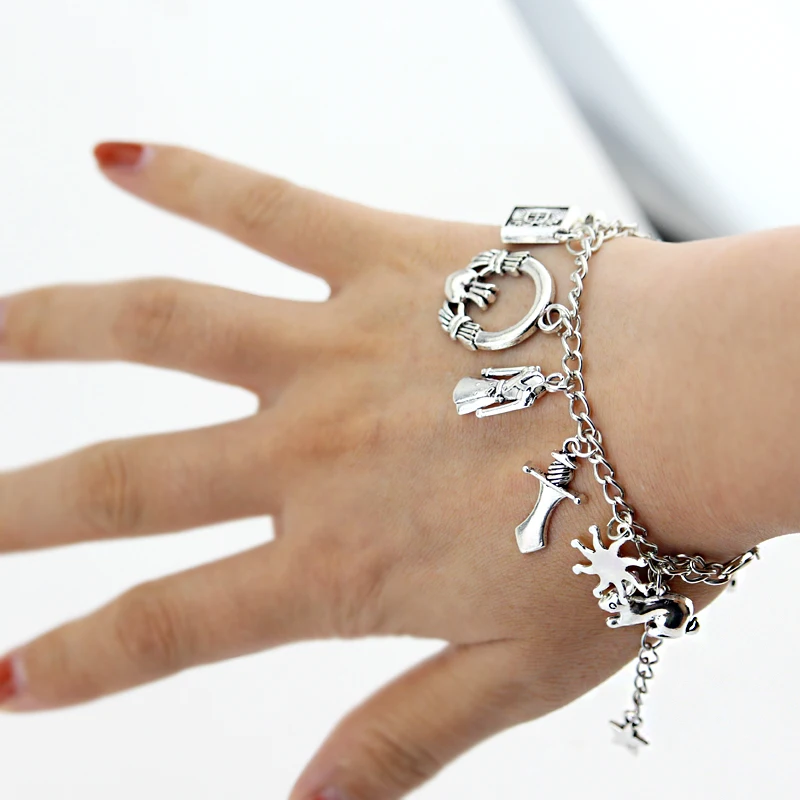 

Buffy the Vampire Slayer Charm Bracelet cross Vampire Fangs Silvertone Charm Bracelet