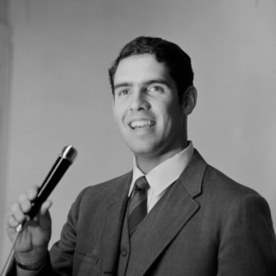 Young man holding microphone Poster Print (18 x 24)