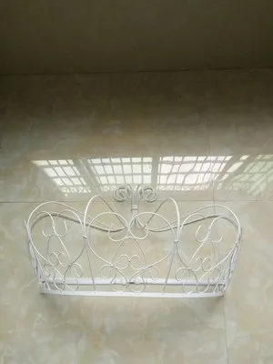 gold and white mosquito net adorns the crown shelf