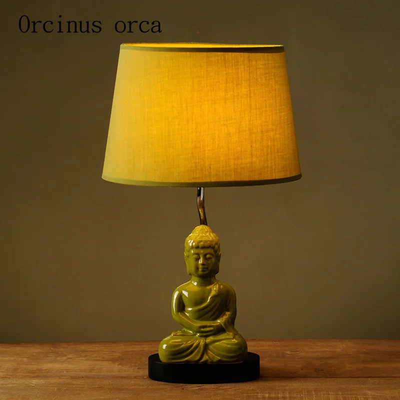 

Nordic table lamp creative minimalist modern retro Buddha lamp bedroom bedside lamp Postage free
