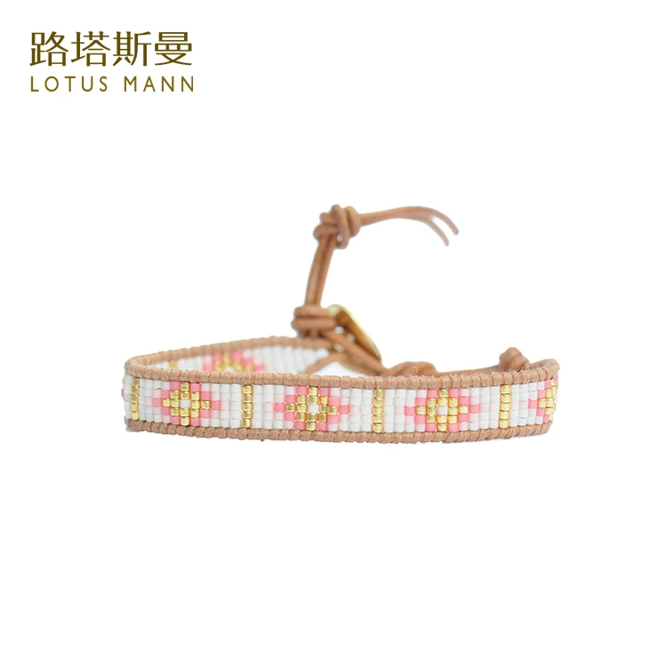 

Lotus Mann Cherry blossom pink lap measle spelling a flower Grey leather cord bracelet