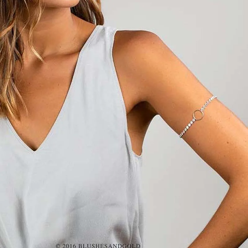 Golds arm. Criss-Cross Halter.