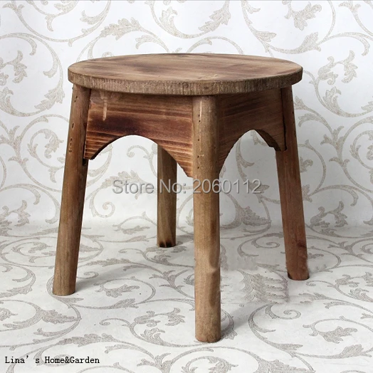 round aged brown wood stool.jpg