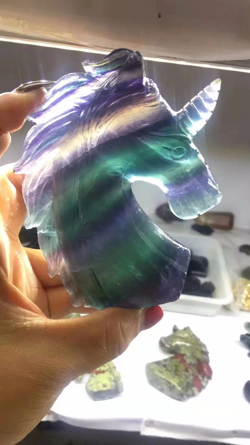 

Beautiful natural colored fluorite hand carved unicorns