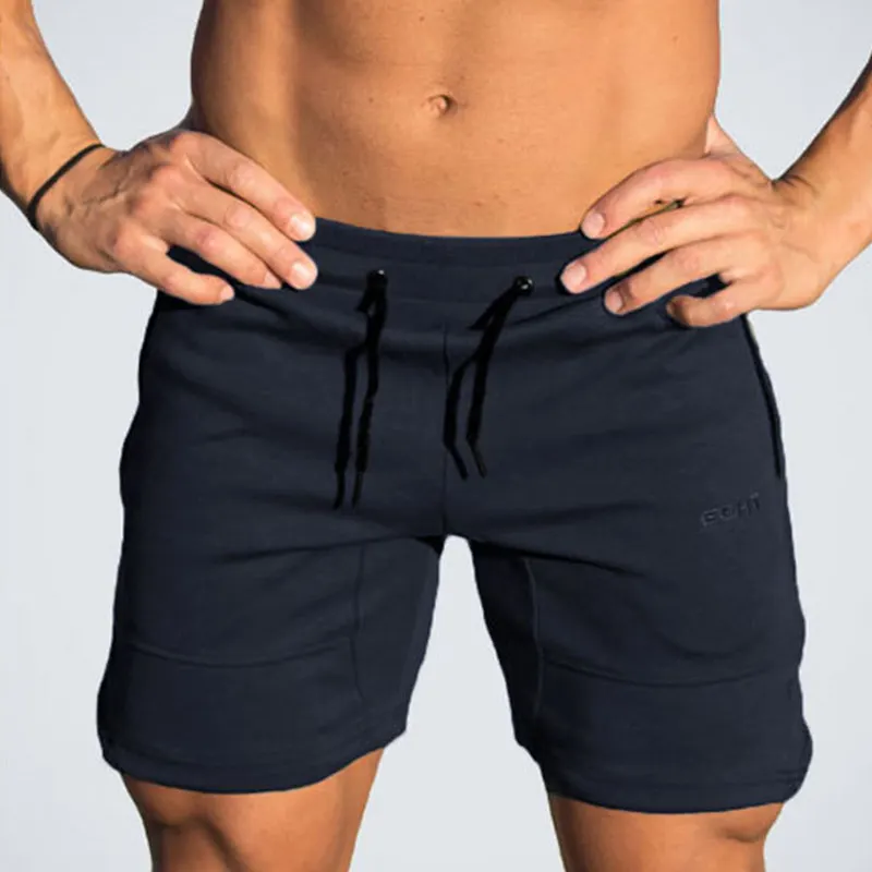 Новая мода Для мужчин спортивные вытаскивание шорты брюки хлопок Бодибилдинг штаны Фитнес короткие Jogger Повседневное тренажерные залы Для