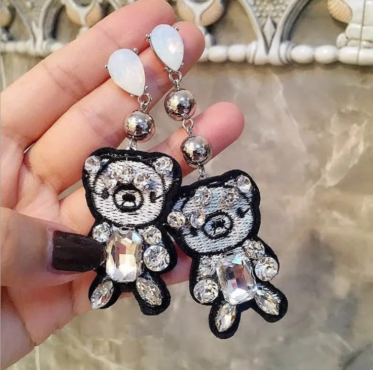 

SALE 925 silver Europe Feather bear Crystal from Swarovskis new fashion creative Woman Twins Earrings micro hot jewelry
