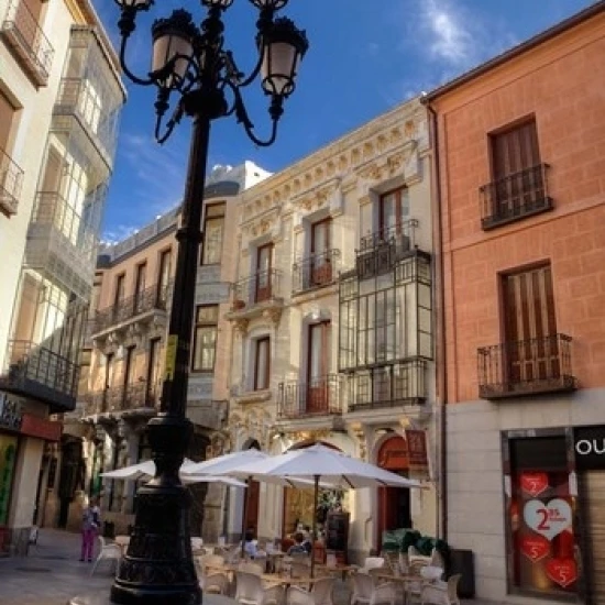 An Outdoor Caf  Avila  Spain Poster Print by Julie Eggers (18 x 24)