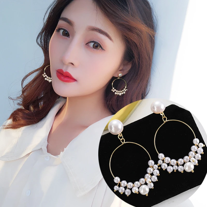 

Shown face thin hollow geometric Pearl Earrings 2019 net red woman Han Baitao simple temperament Pearl Earrings