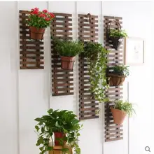 Solid wood grid is hanged wall flower wearing wall is hanged wall adornment suspends type flowerpot to wear hanged man the exp