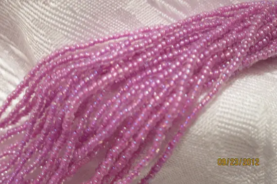 

11/0, Preciosa Seed Beads, Trans Rainbow Color-Lined Rose Purple #58525 - 1/2 & Full (12-strand) Hanks are Available from the 'O